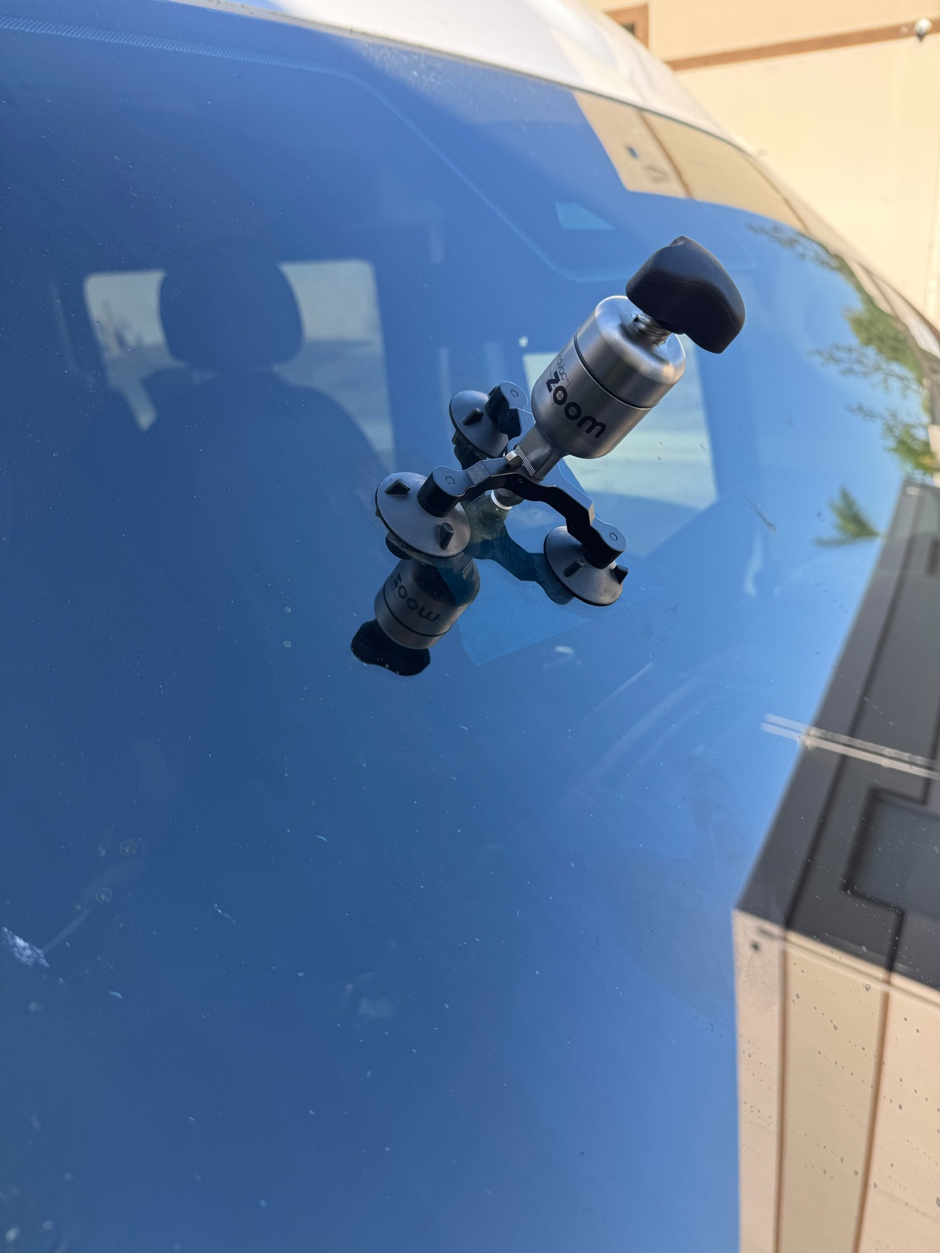 Resin injection tool installed over a windshield chip